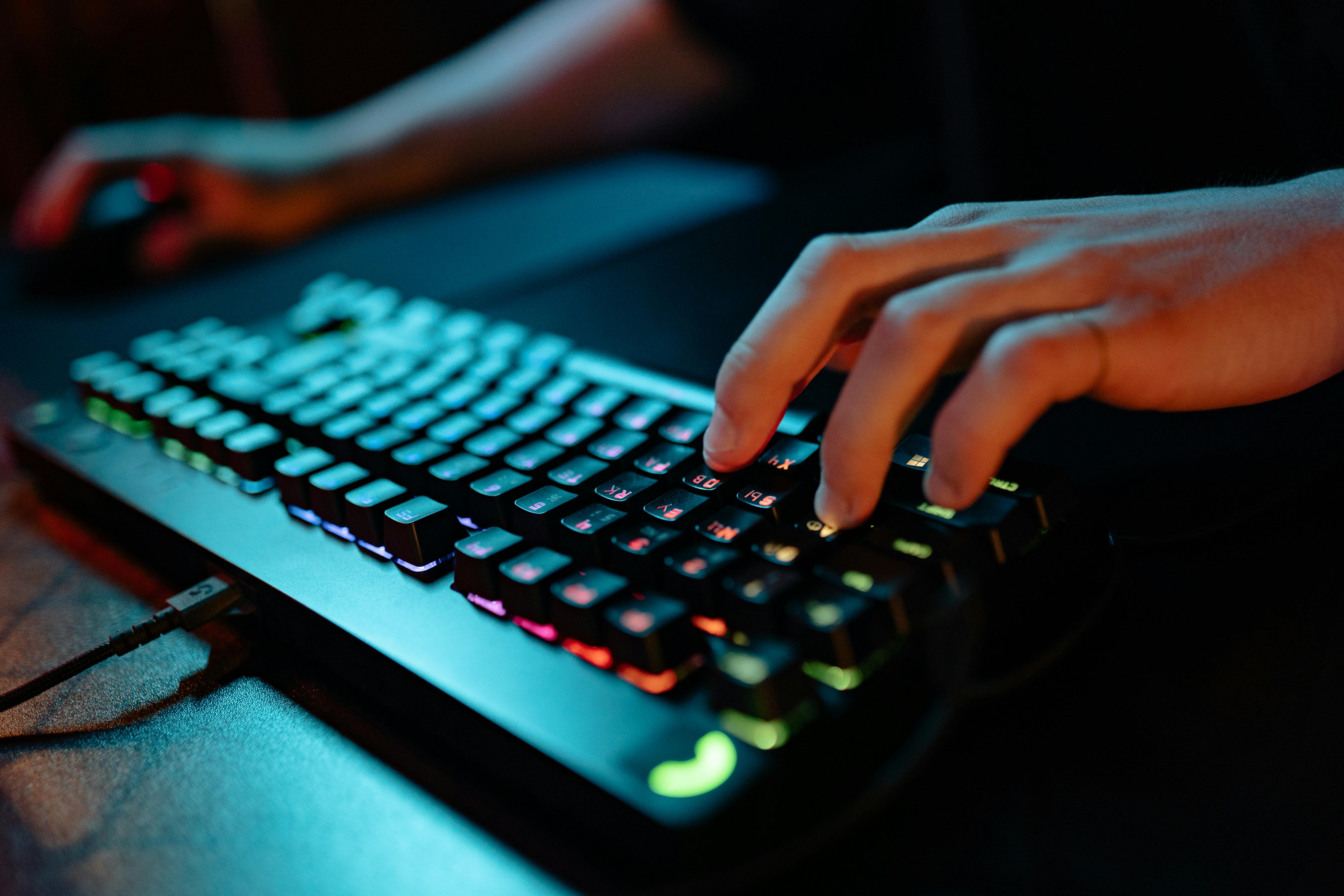 a person playing games with a keyboard and mouse